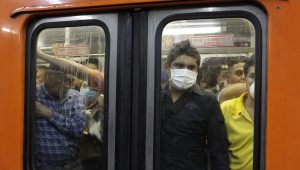 Mexican Flu Masked Train Passengers